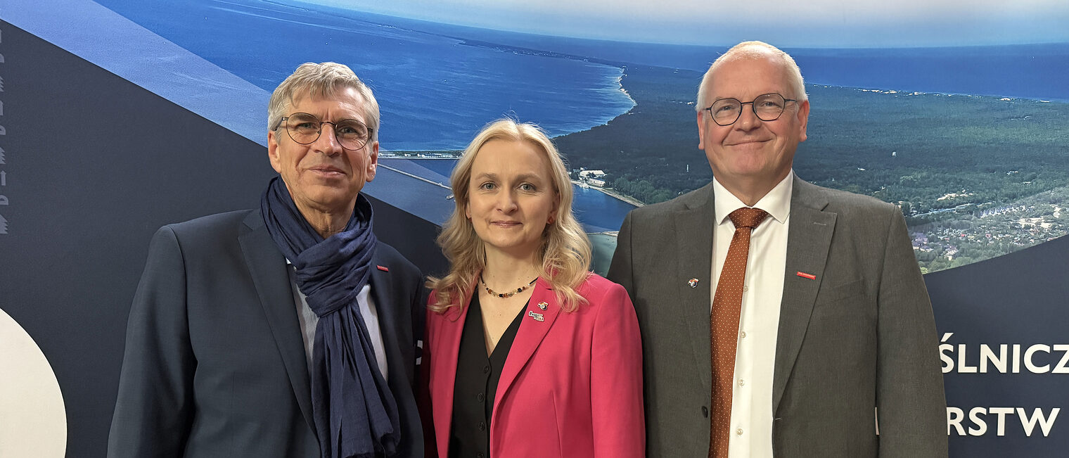 Gruppenfoto von drei Personen